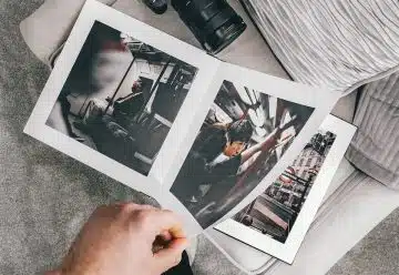 person holding black dslr camera